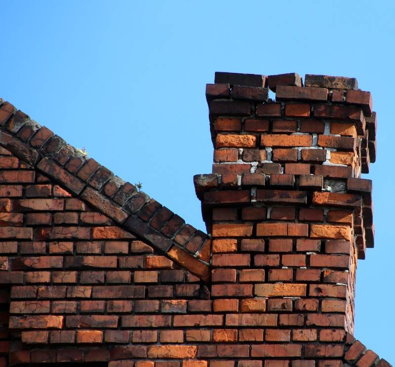Signs Your Boyds Home Needs a Chimney Inspection Damaged chimney on an Boyds home showing cracks and missing mortar